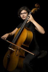 Young woman plays cello © mikhaluk