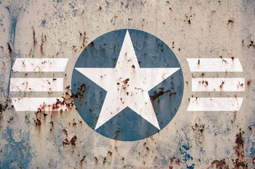 Military star on battered metal