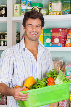 Man With Vegetable Basket In Grocery Store