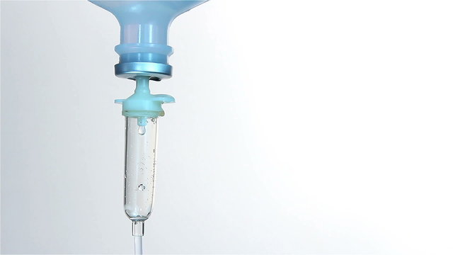 Intravenous drip chamber on white background