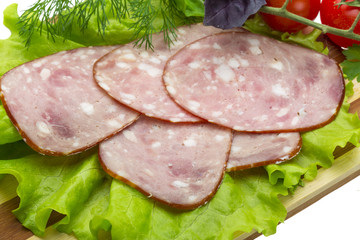 Sausages with salad and basil