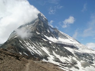 Pathway to Hörnli Hut with Matterhorn 4478 m in clouds