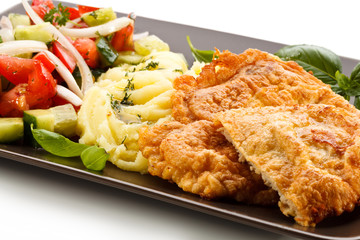 Pork chops, mashed potatoes and vegetable salad