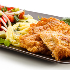 Pork chops, mashed potatoes and vegetable salad