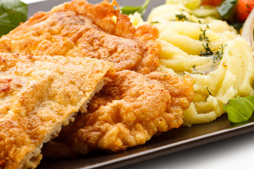 Pork chops, mashed potatoes and vegetable salad