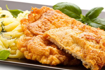 Pork chops, mashed potatoes and vegetable salad