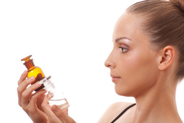 Fototapeta premium woman with two bottles of medicine or perfume