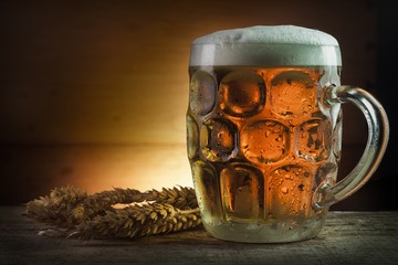 mug of beer on wooden table