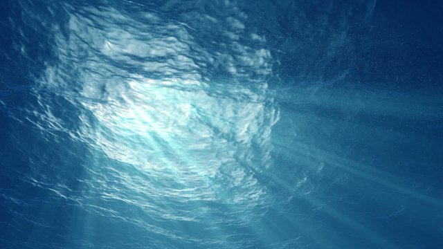 High quality Looping animation of ocean waves from underwater with floating plancton. Light rays shining through. Great popular marine Background. (seamless loop, HD, high definition 1080p)