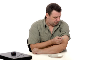 Fototapeta premium Man giving himself intramuscular shot