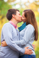 couple kissing outdoor in the park
