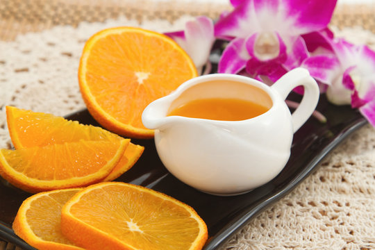 Orange juice and fresh fruit on  wooden table