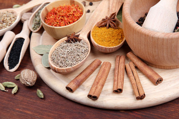 Various spices and herbs on wooden table