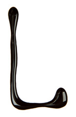 Big letter of alphabet made from chocolate syrup, isolated