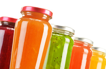Jars of fruity jams isolated on white background