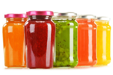 Fototapeta na wymiar Jars of fruity jams isolated on white background