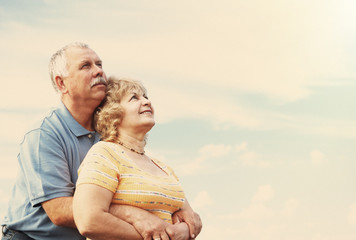 Old people over sky background