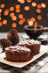 Chocolate cake with blurry christmas lights.