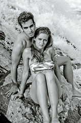 Romantic couple next to river waterfall