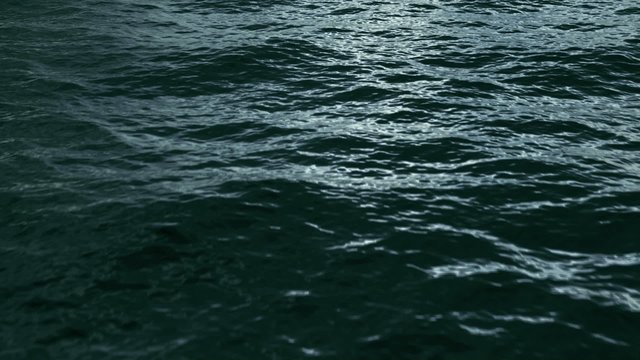 Fly over ocean dark green water surface, loopable. (HD, high definition 1080p, seamless loop). Great background for movie credits