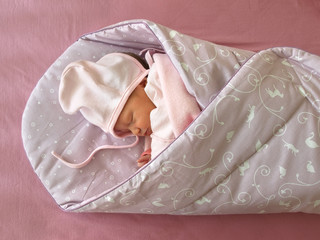 Sleeping newborn in the Swaddle Wrap Blanket