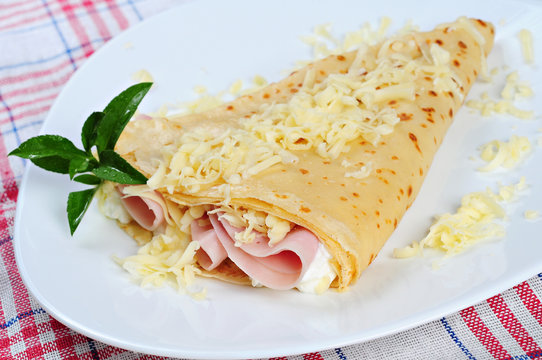 rolled pancakes stuffed ham and cheese