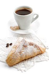 Sweet croissant and cup of coffee