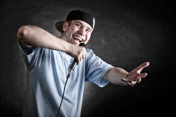 Rap singer man with microphone cool hand gesture