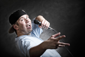 Rap singer man with microphone cool hand gesture