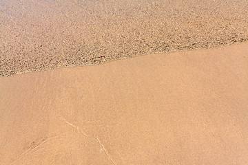 Fototapeta na wymiar Ripple water on the beach