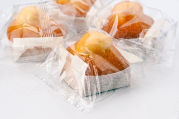 cupcakes individually wrapped in transparent plastic