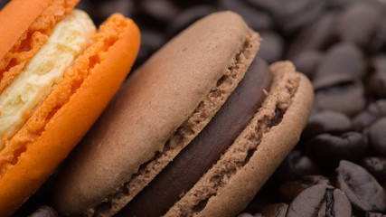 macaroon cookies on a background of coffee beans