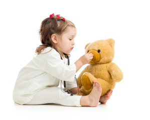 child girl playing doctor with toy