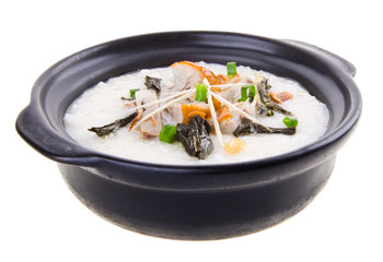 Traditional chinese pork porridge rice gruel served in claypot
