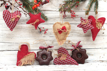 Christmas decoration and gingerbread over wooden background
