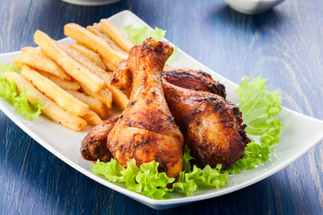 Chicken drumsticks with french fries