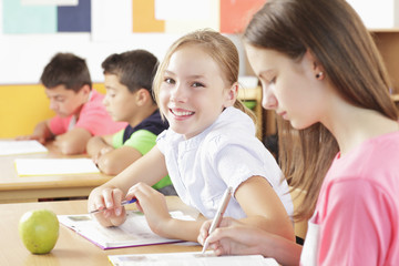 Children are sitting in the classroom