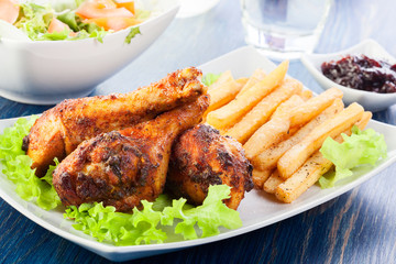 Chicken drumsticks with french fries