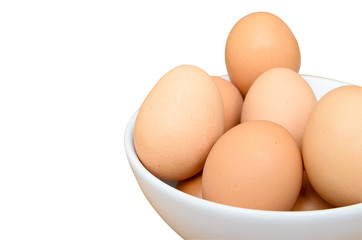 Eggs in white bowl isolated on white background