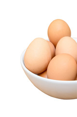 Eggs in white bowl isolated on white background