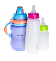 Baby bottle with milk on background