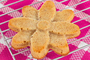 Homemade muffin in the shape of flower  on cooling rack