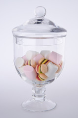 Candies. colorful candies in glass jar on background
