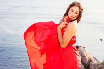 Fashion model woman with blowing flying dress