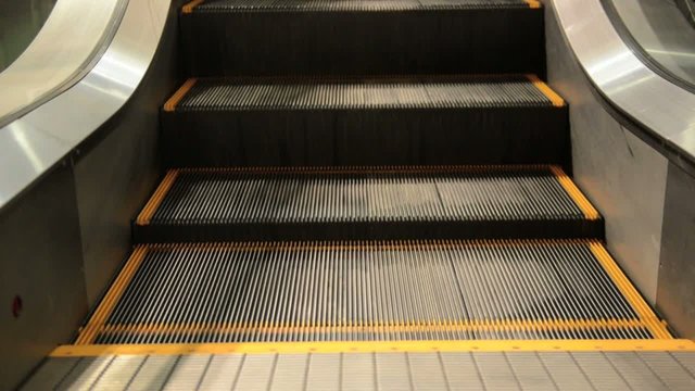 movement of the  escalators stairway inside  shopping center