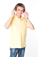 young and handsome man listening to music on headphones