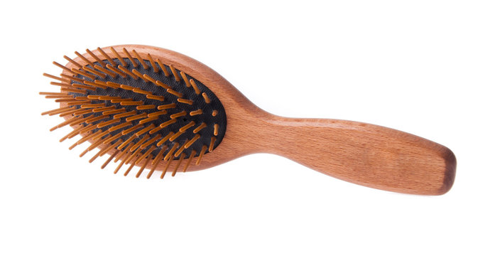 Wooden old comb on blackground