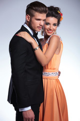 fashion couple with woman holding hand on man