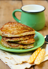 pancakes with honey and cup of milk
