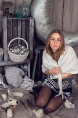 Girl surrounded by Christmas paraphernalia